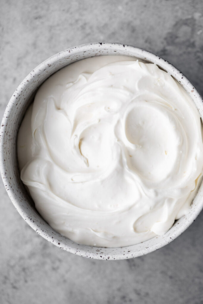 Honey lemon cream cheese topping whipped in a bowl.