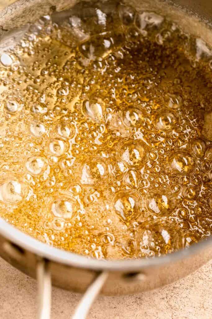 Sugar and water boiled in a pan until it turned an amber color.