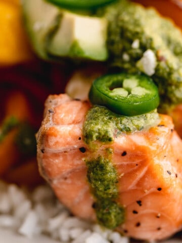 Salmon and rice bowl with chimichurri and jalapenos.
