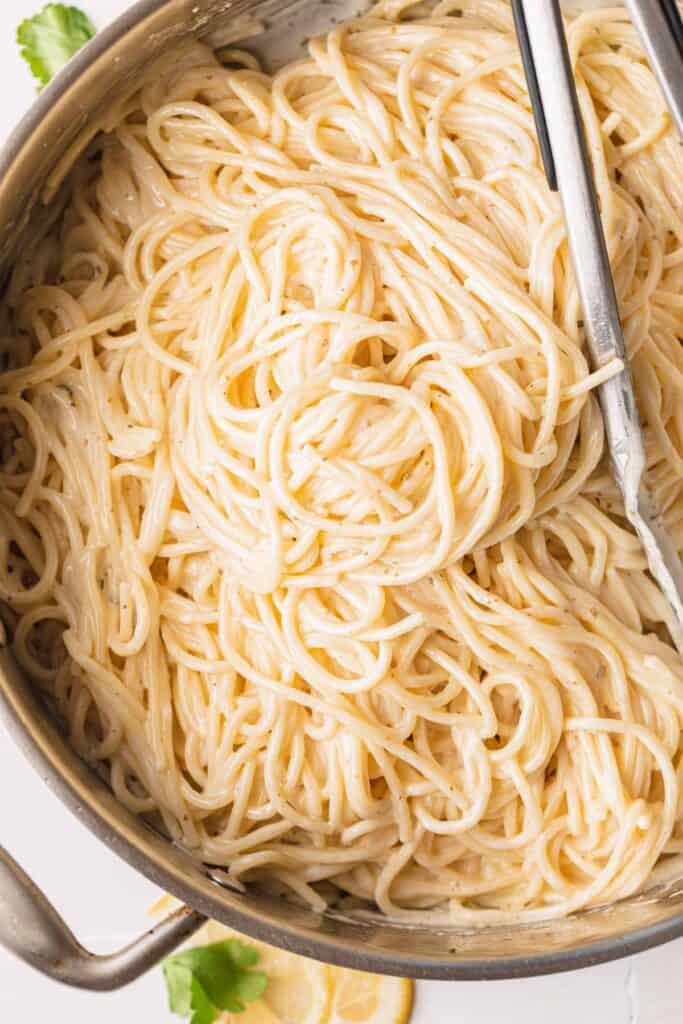 Spaghetti mixed in the creamy lemon sauce. 