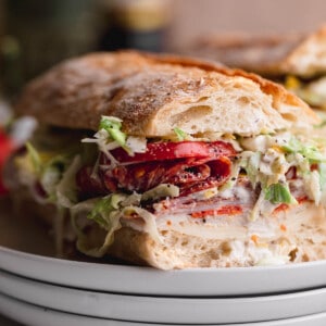 TikTok Grinder Sandwich on a stack of plates.