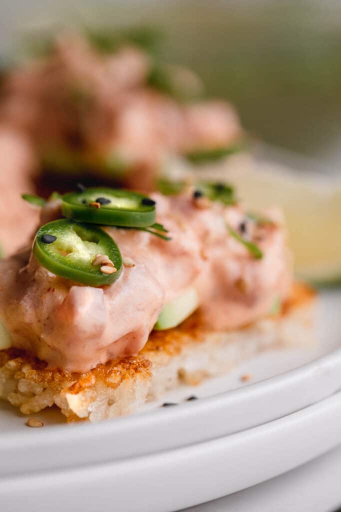 Spicy tuna piled on top of crispy fried rice with avocado, jalapeno and sesame seed.