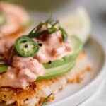 Spicy tuna on top of crispy rice with avocado and jalapeno.
