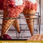 Strawberry crunch cheesecake cones in a wire rack holder.