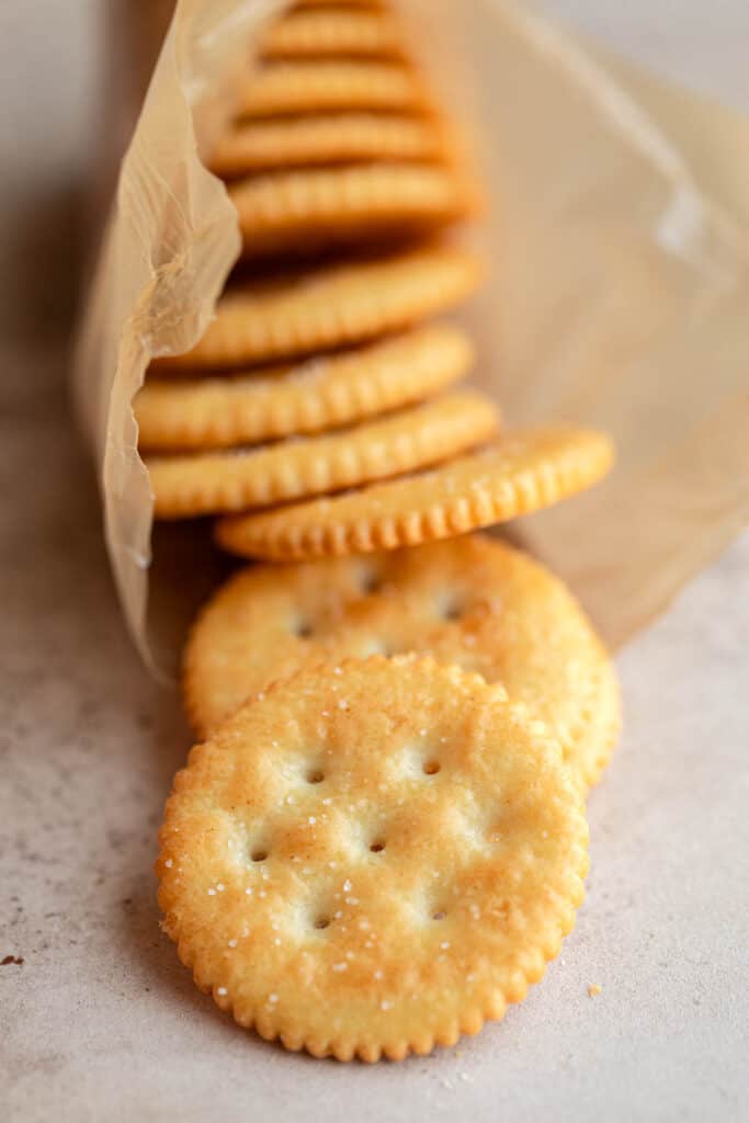 Ritz crackers falling out of their package.