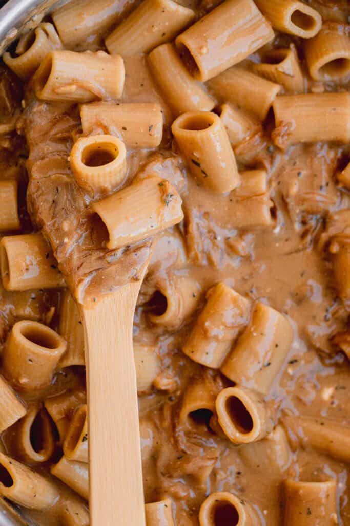 Pasta mixed in sauce.