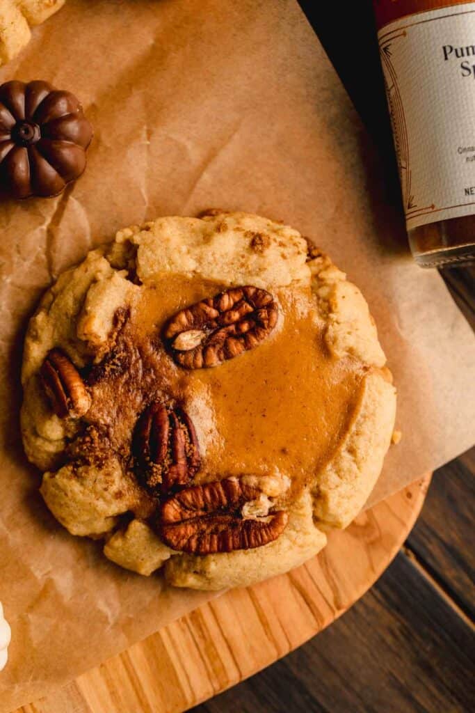 Pumpkin Cheesecake Cookie with brown sugar pecans on top.