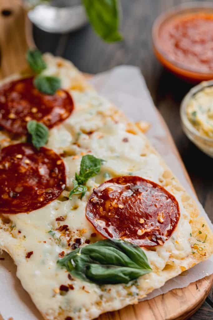 Pepperoni pizza with basil.