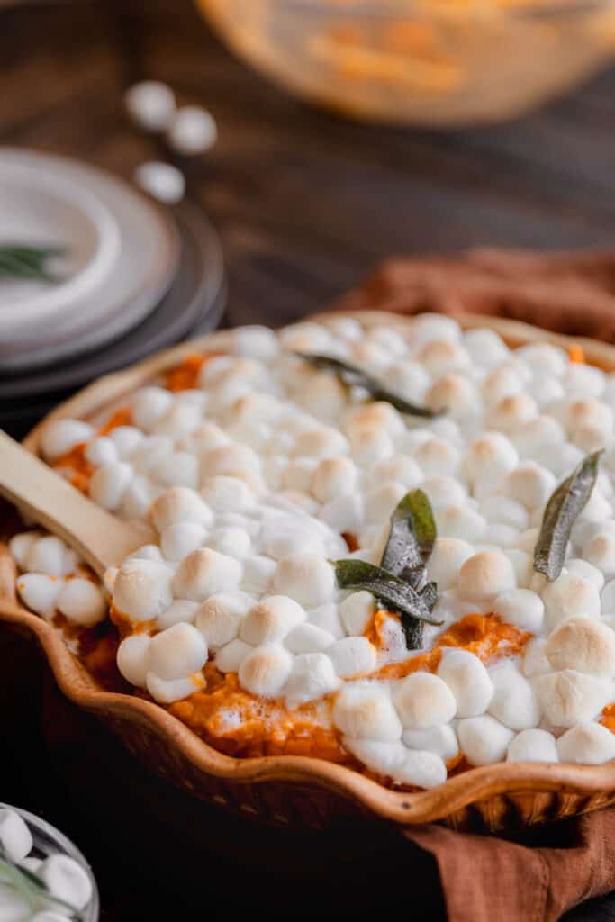 Sweet Potato Pudding with brown butter, sage and marshmallows in a pie pan.