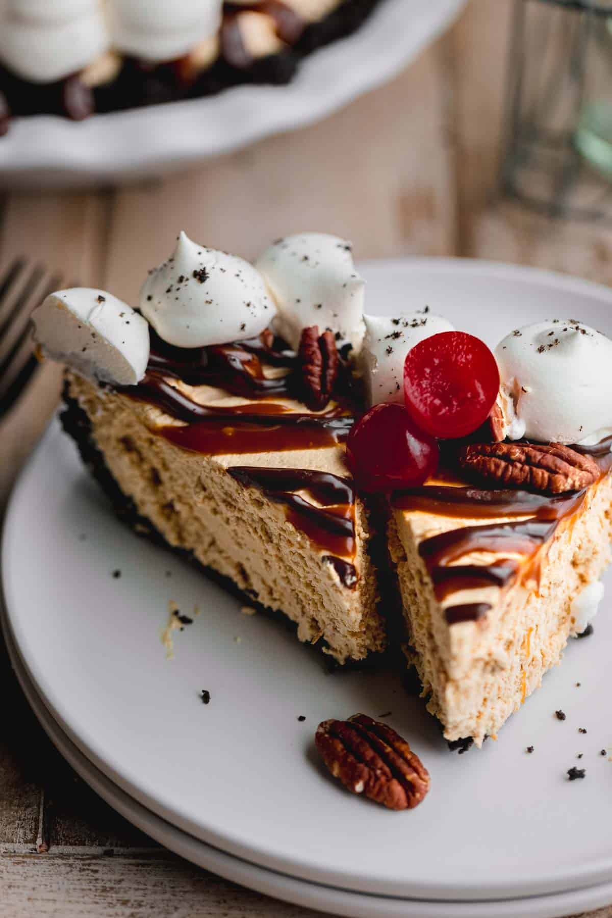 No bake Turtle pie with chocolate ganache, caramel sauce, cherries and cool whip.