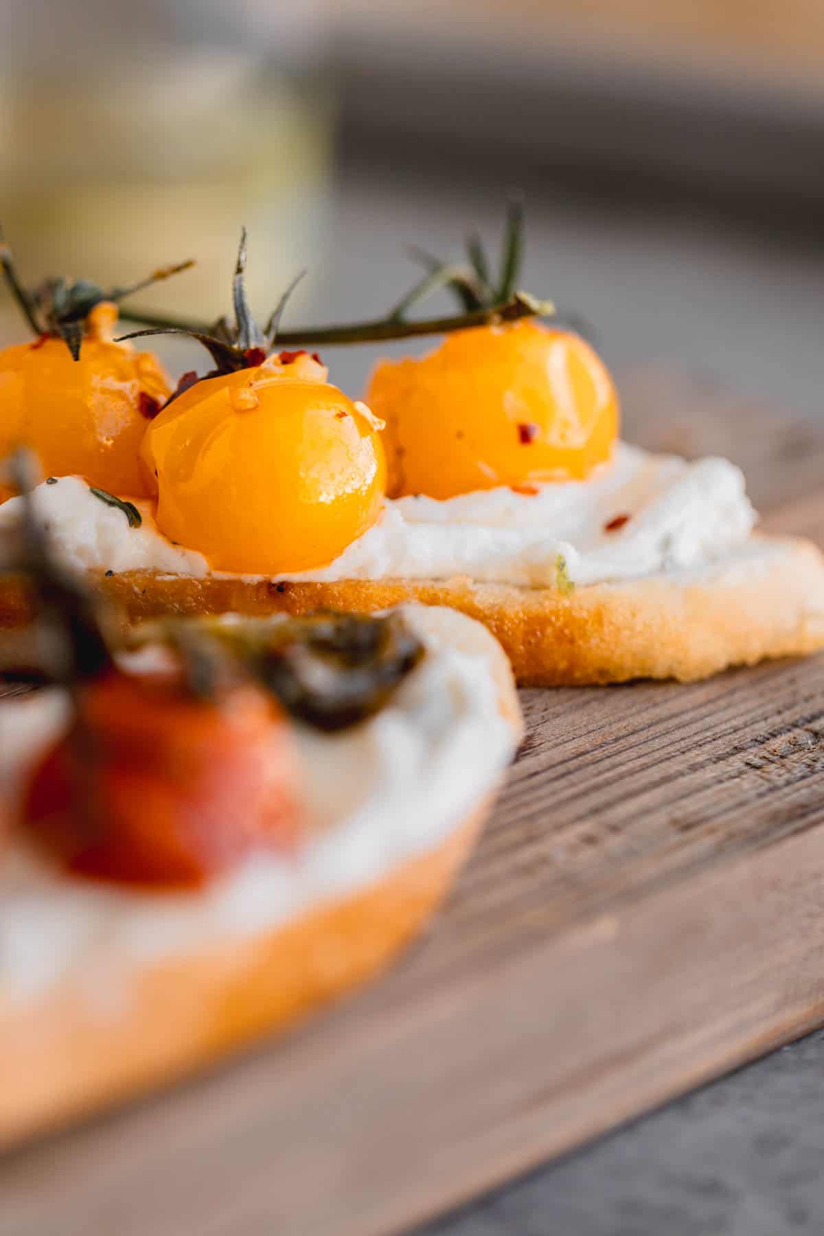 Cherry tomato confit on a crostini with whipped goat cheese. 