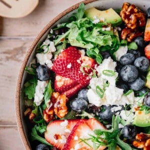 Strawberry Summer Salad with berries, feta, avocado and nuts.
