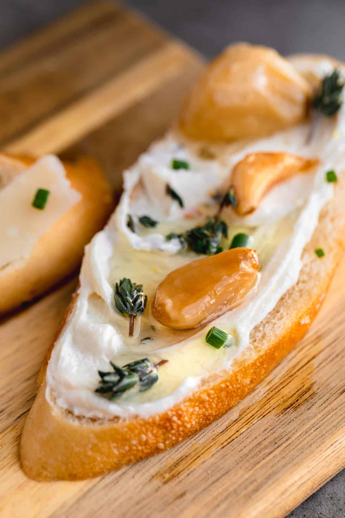 Garlic confit over the top of whipped goat cheese crostini.