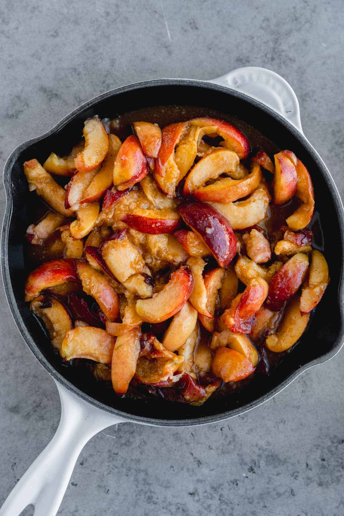 Spiced peaches in a cast iron skillet. 