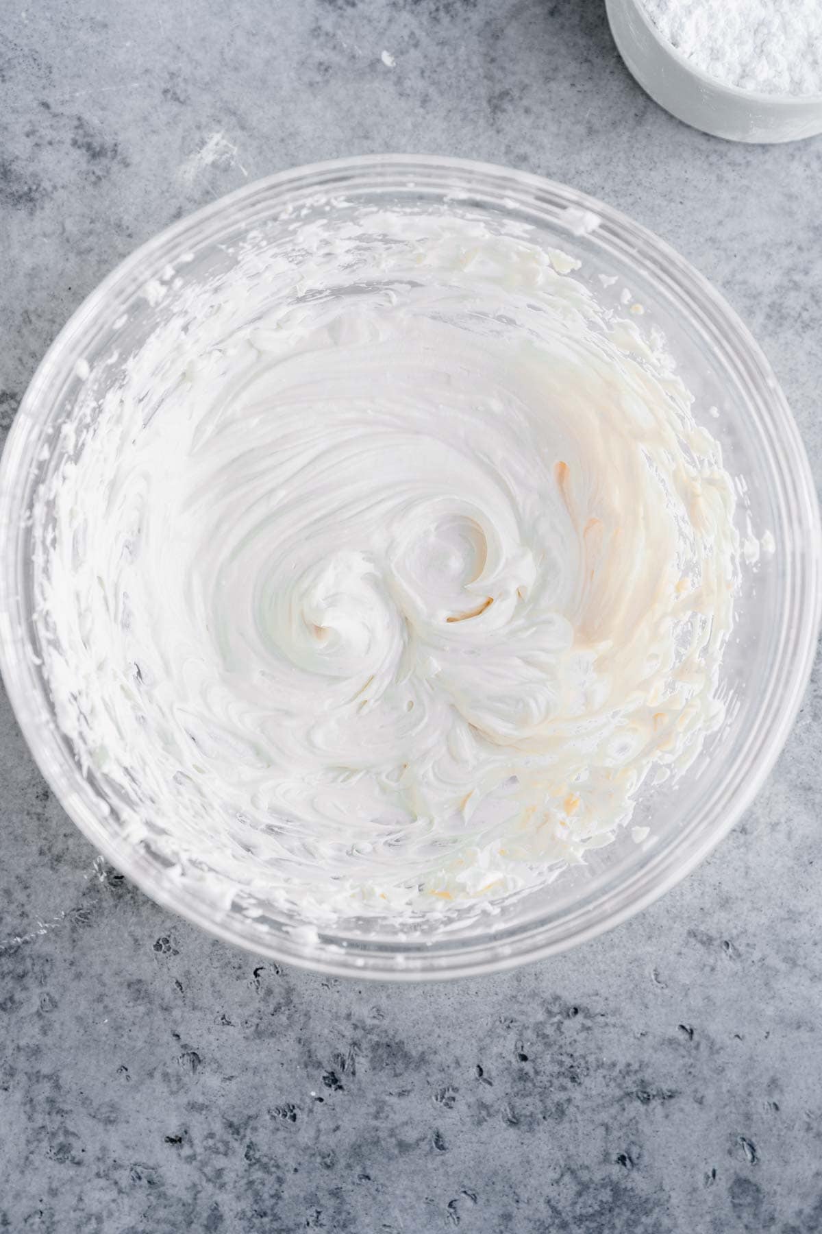 Cream cheese frosting in a bowl. 