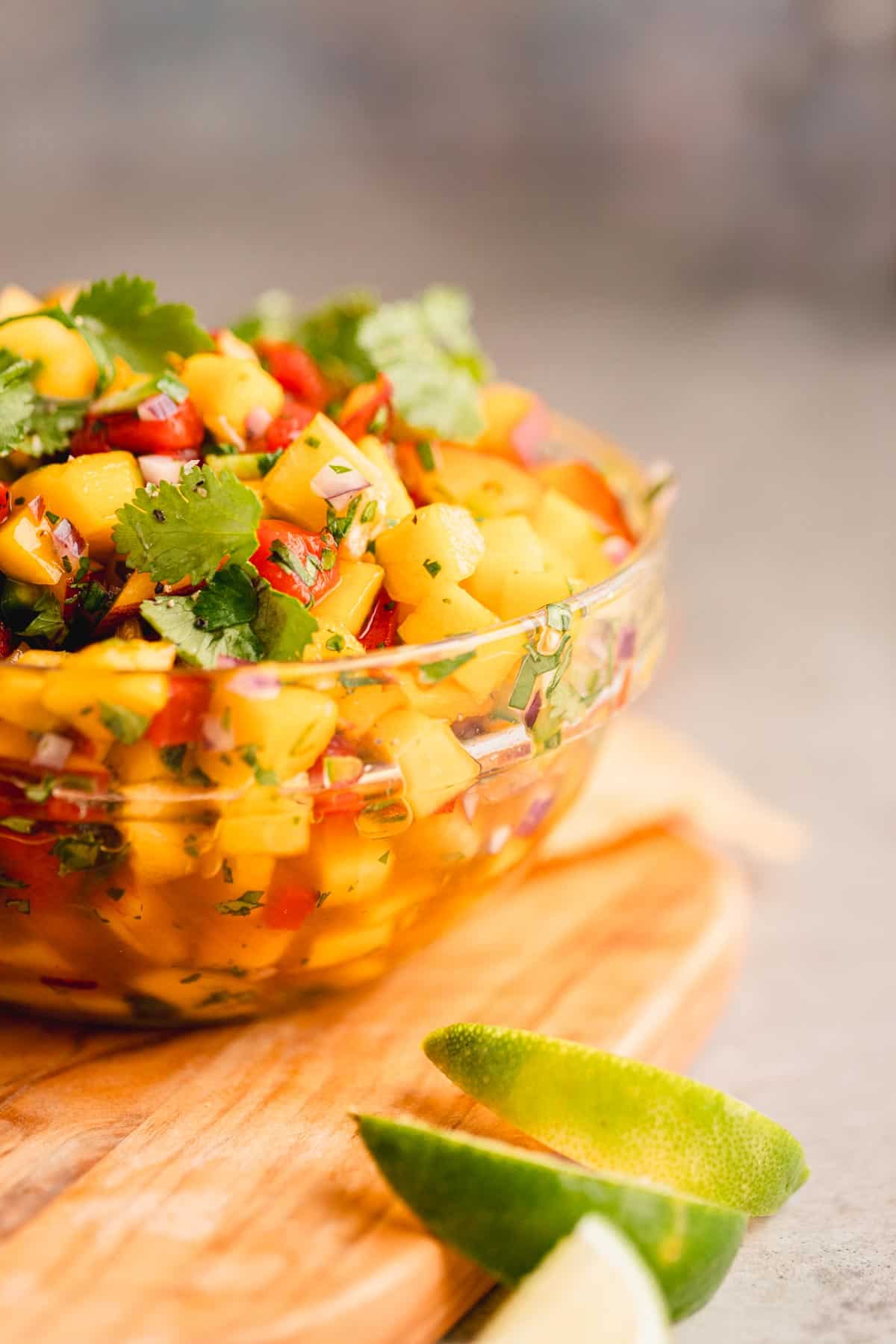 Peach Mango Salsa in a bowl topped with cilantro. 