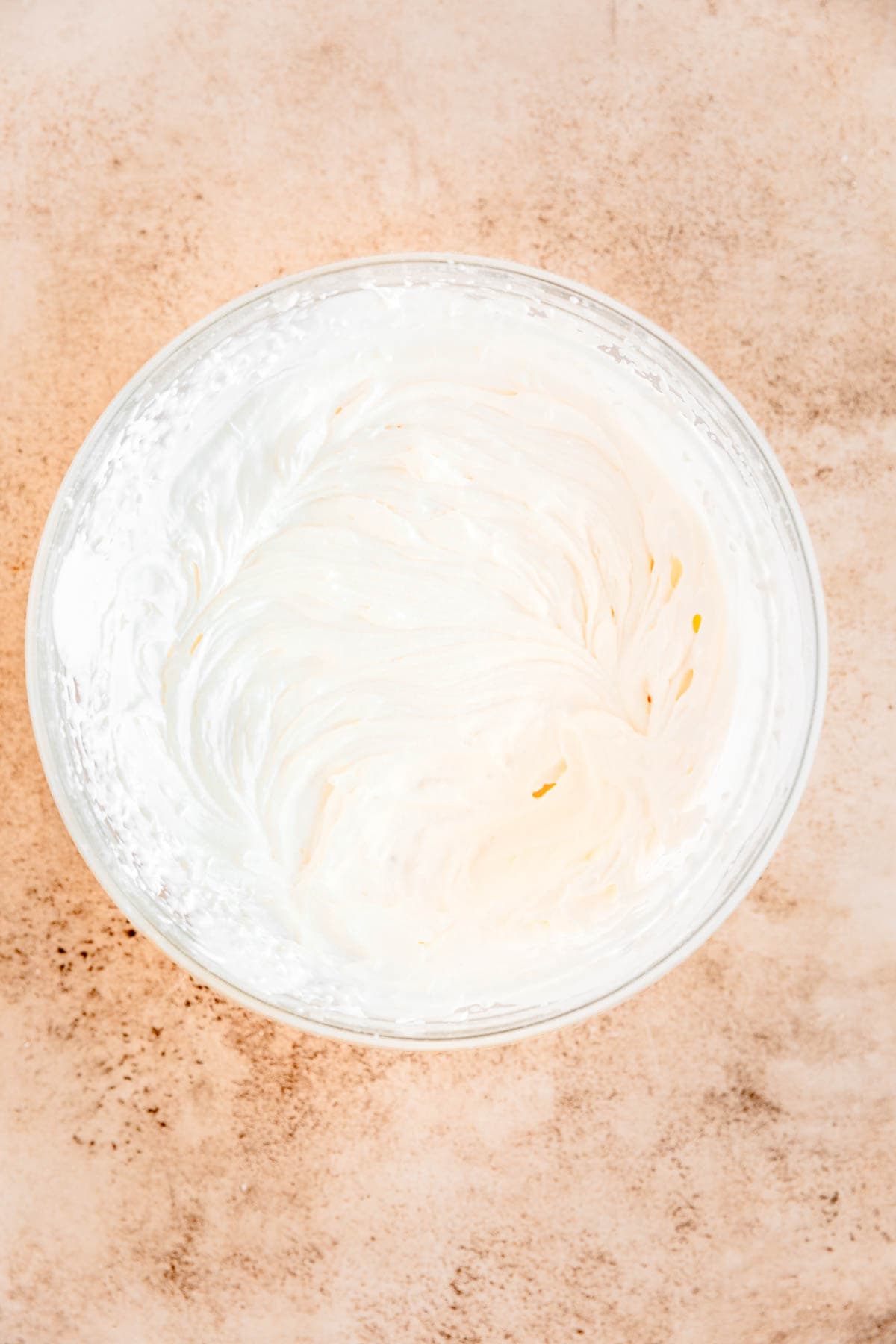 Maple whipped cream in a large mixing bowl. 