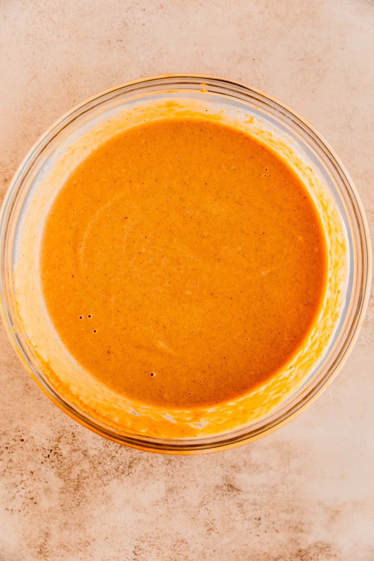 Pumpkin pie mixture in a mixing bowl. 