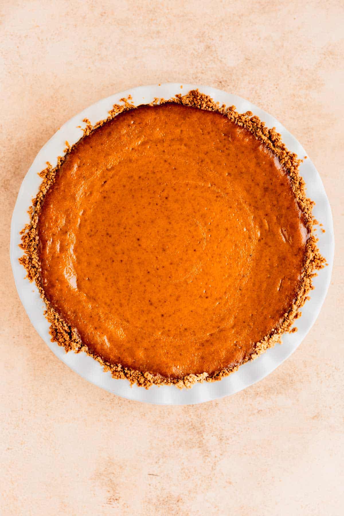 Baked pumpkin pie in a pie pan. 