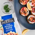 Alexia® Potato Pancakes with Smoked Salmon topped with capers, chive, tomatoes and dill.