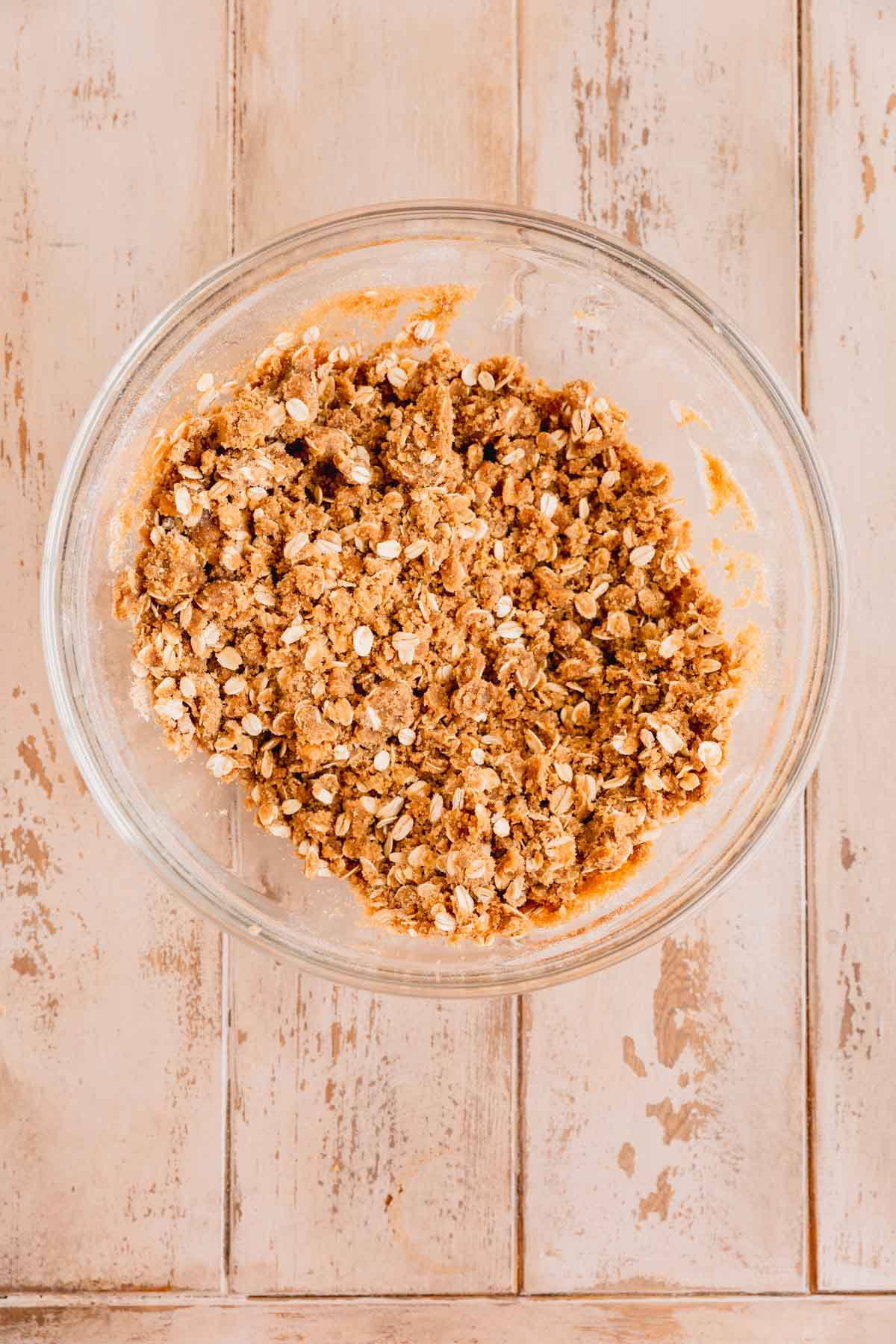 Crumble mixture mixed together in a glass bowl. 