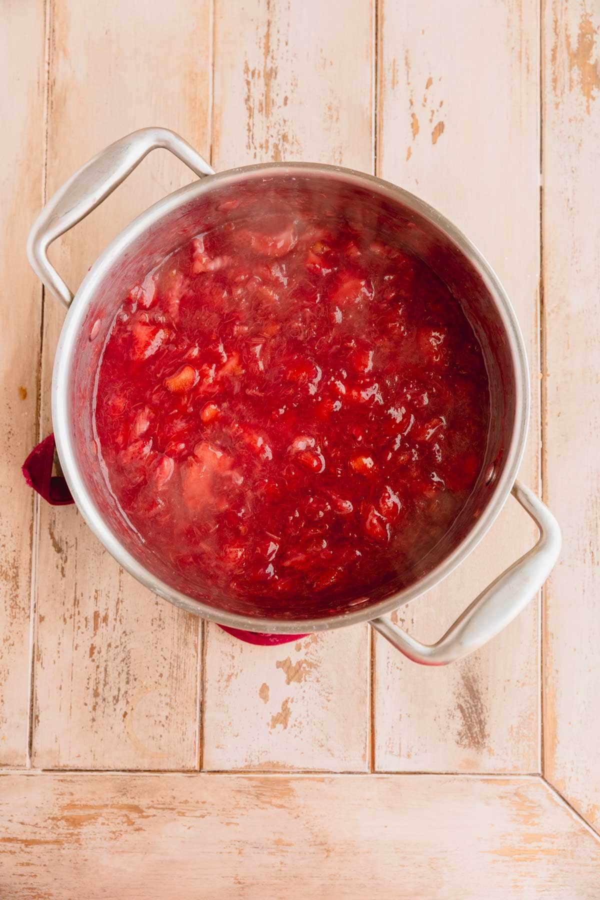 Fruit mixture cooked together in a pot.