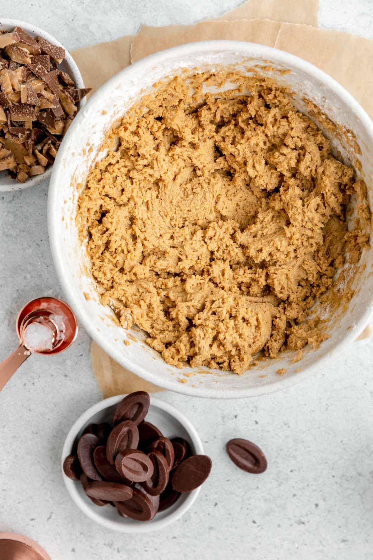 Dry ingredients added into the wet ingredients in a mixing bowl. 