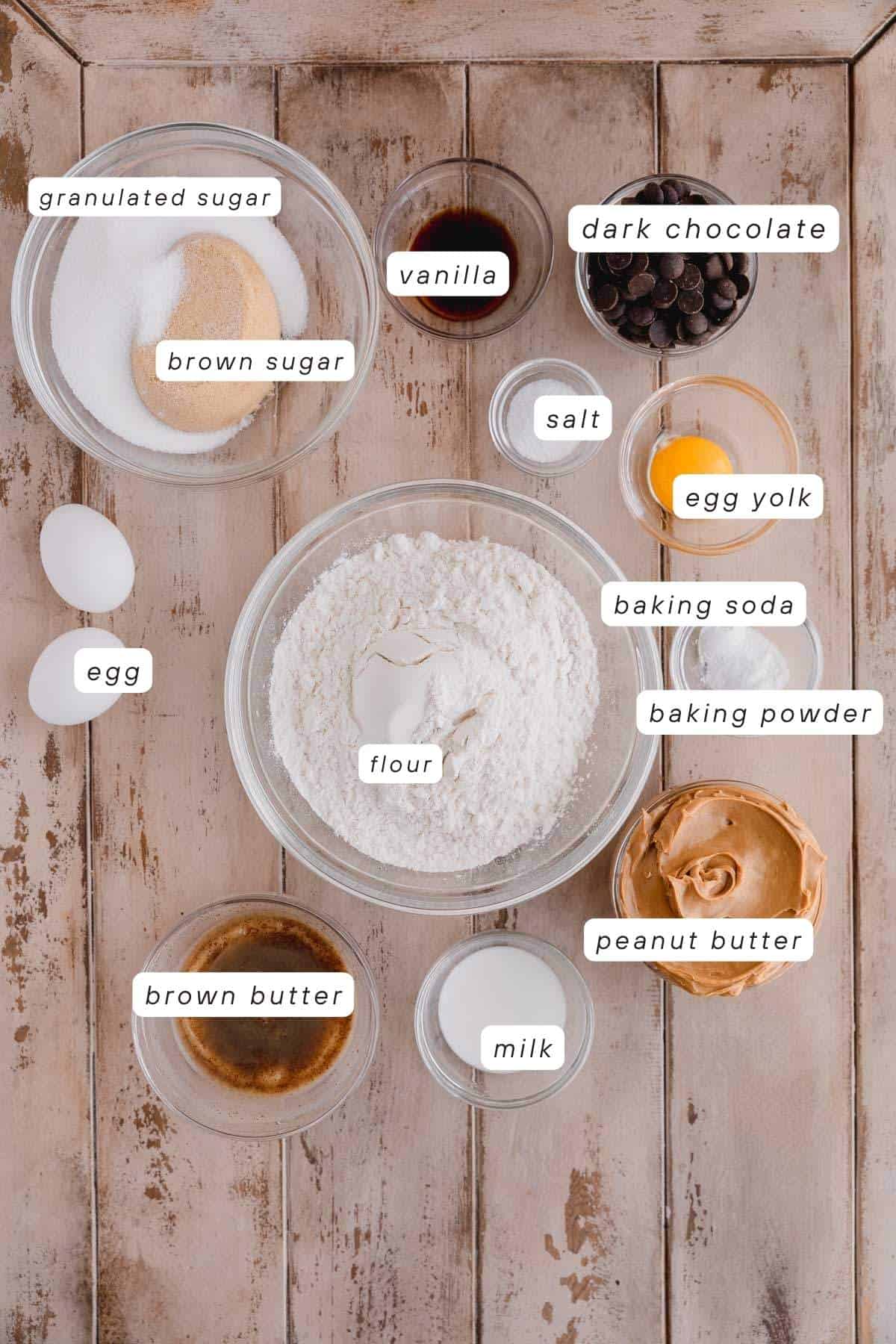 Granulated sugar, brown sugar, vanilla extract, dark chocolate chips, eggs, egg yolk, baking powder, baking soda, flour, peanut butter, milk, salt, brown butter.