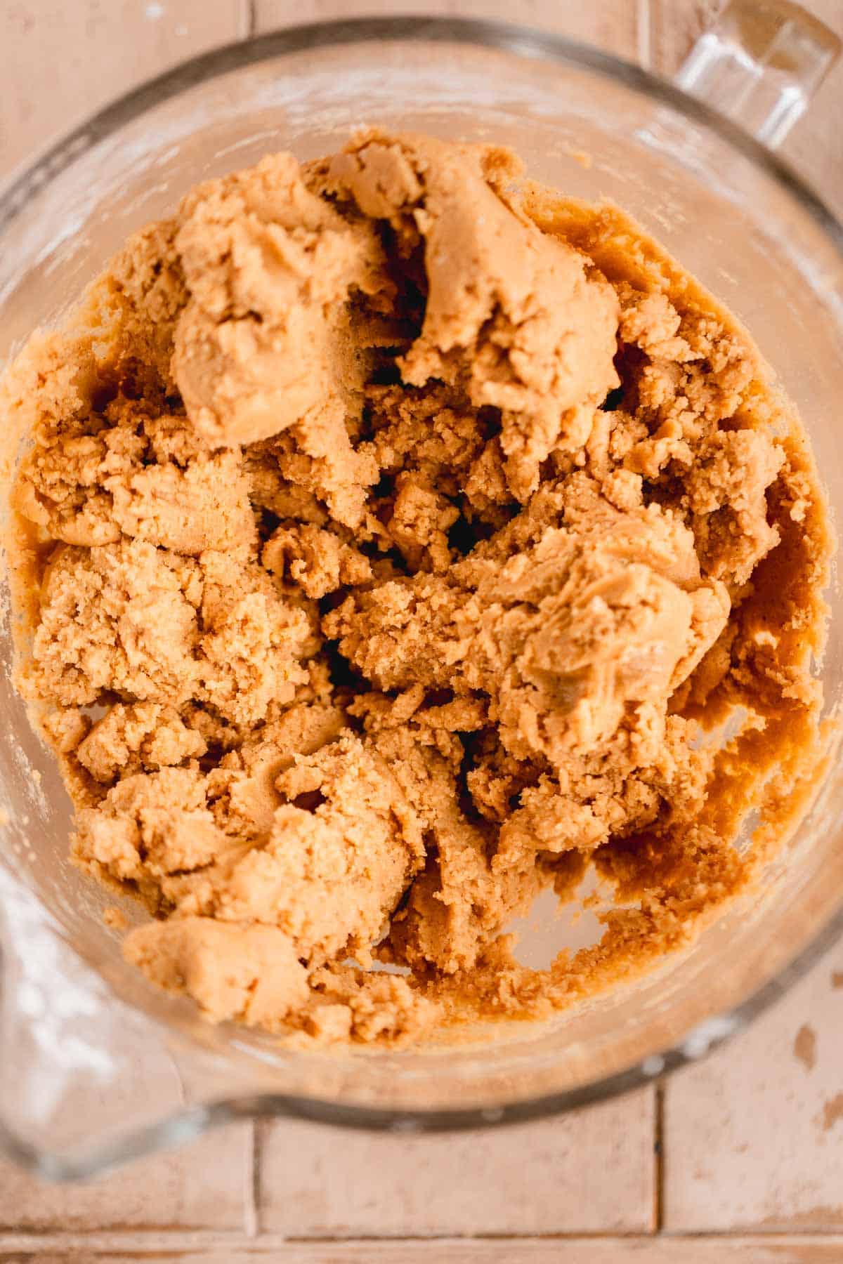 Dry ingredients mixed into the wet ingredients in a mixing bowl.