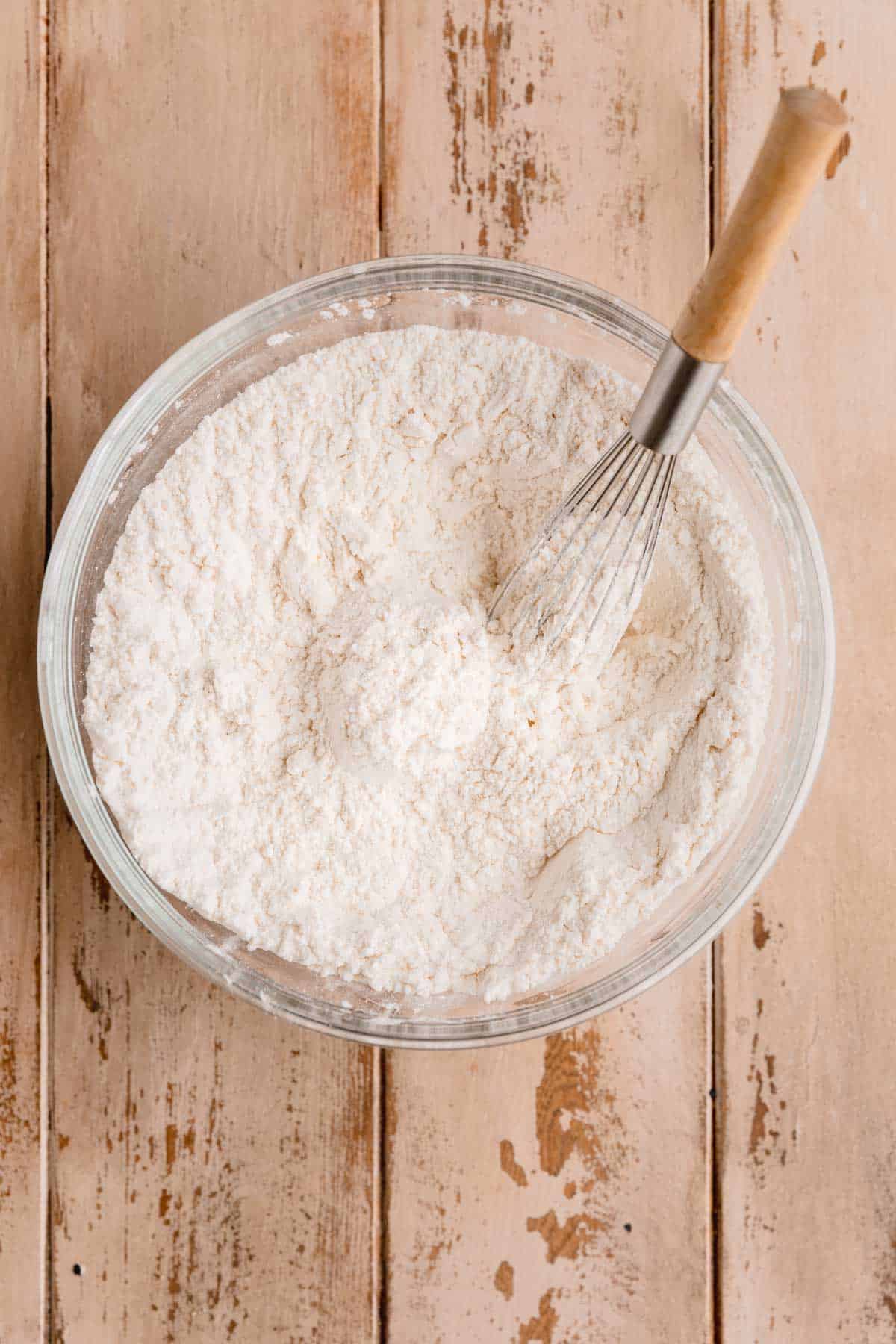 Dry ingredients whisked together in a bowl.
