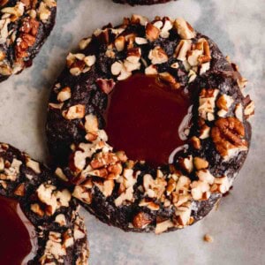 Turtle Cookie filled with homemade caramel in the center and coated in chopped pecans.