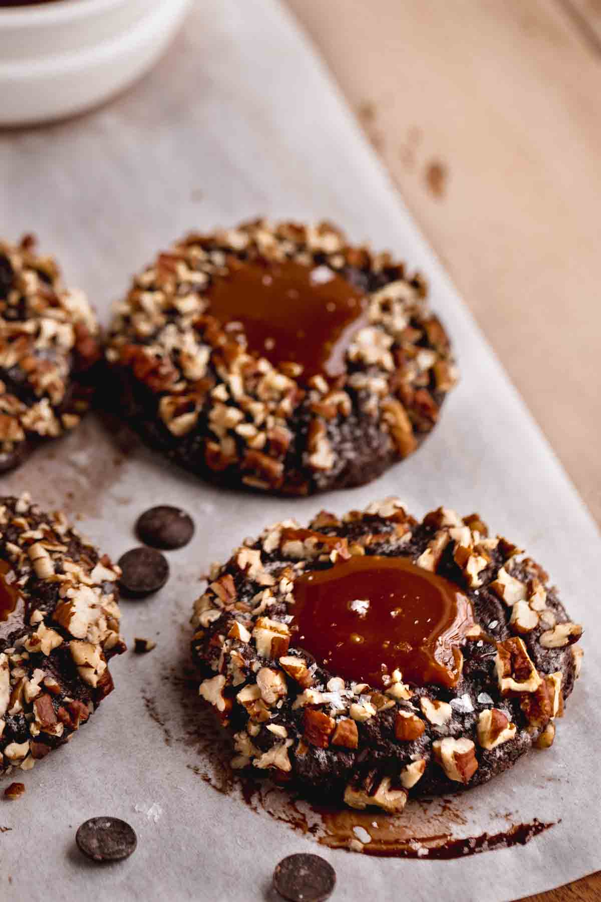 Turtle Cookie with homemade caramel filling on parchment paper.