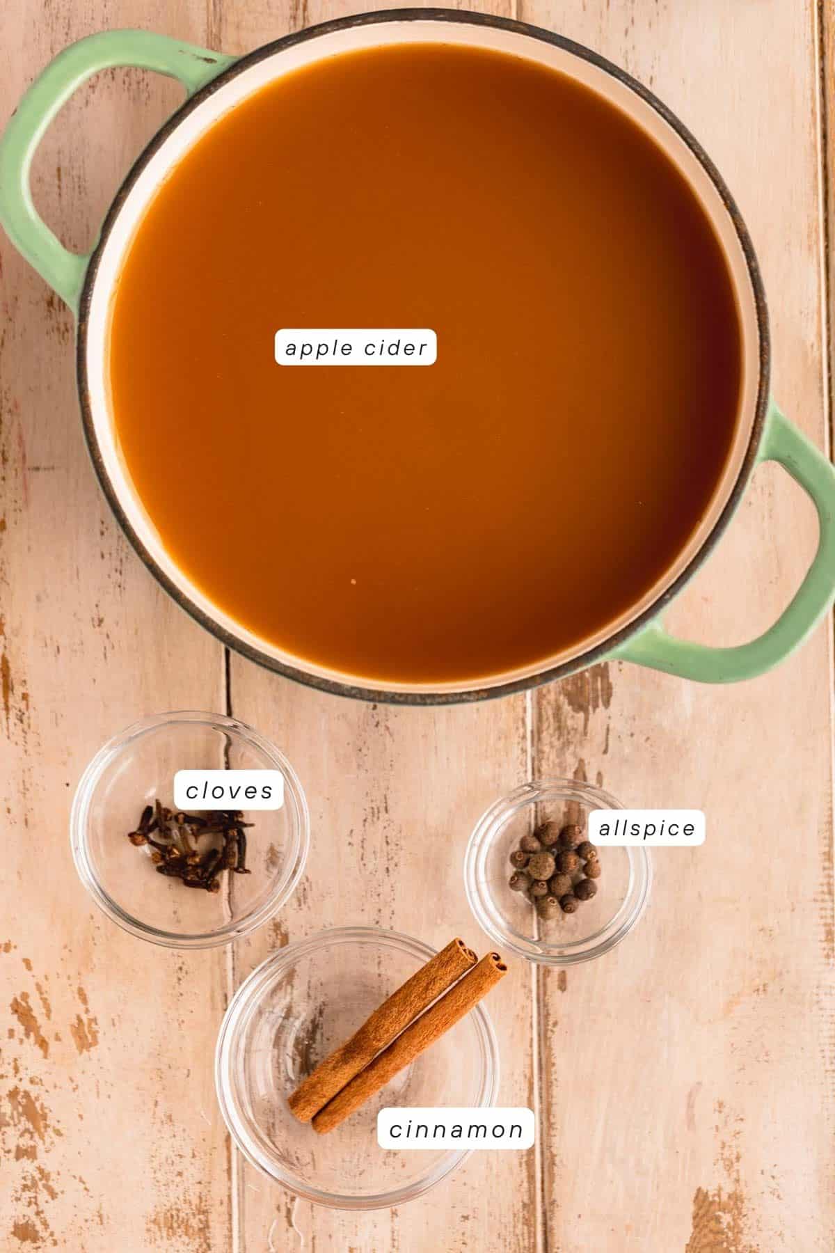 Apple cider, whole cloves, whole allspice and cinnamon sticks.