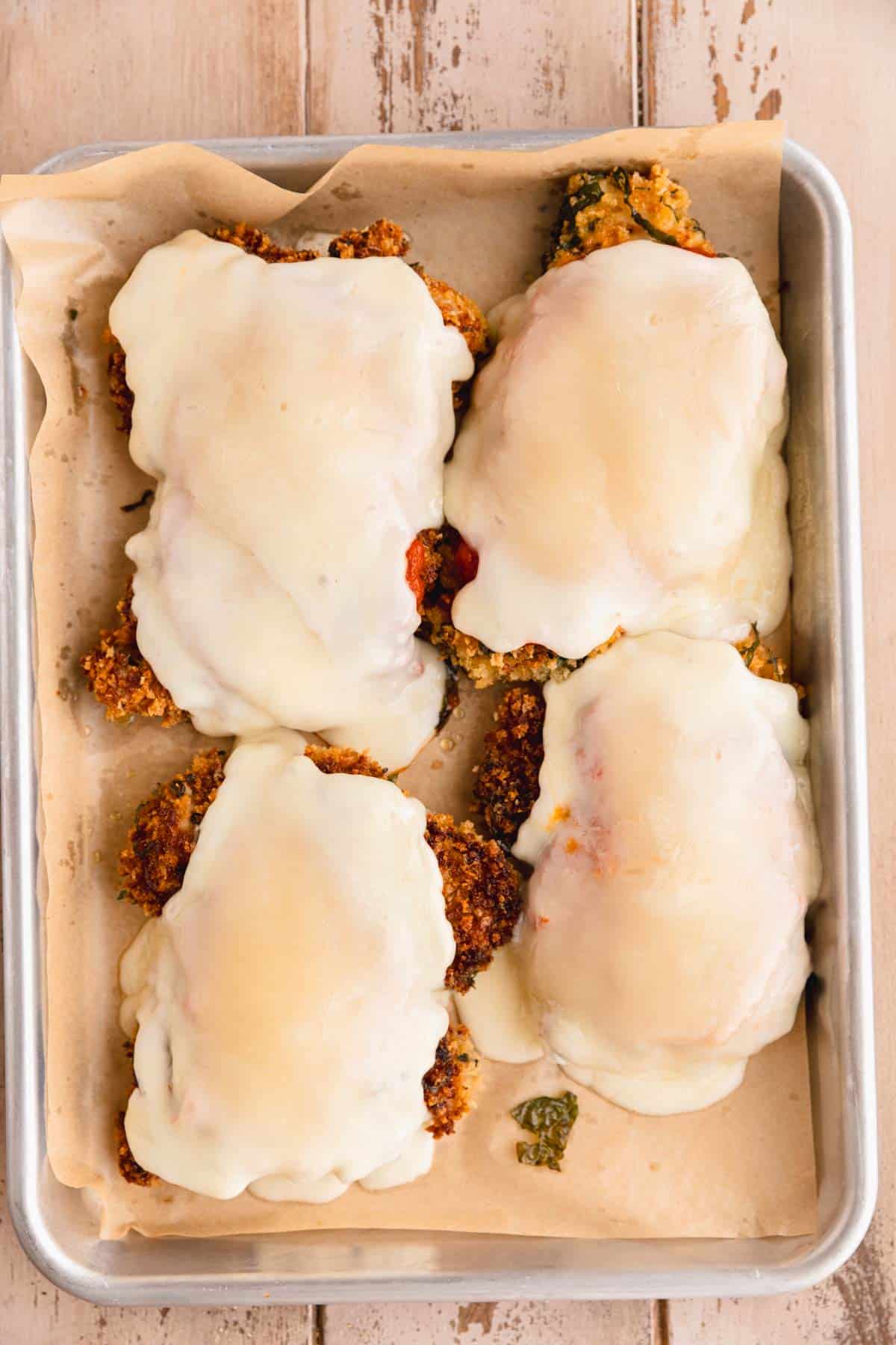 Marinara and melted fontina on top of breaded chicken.