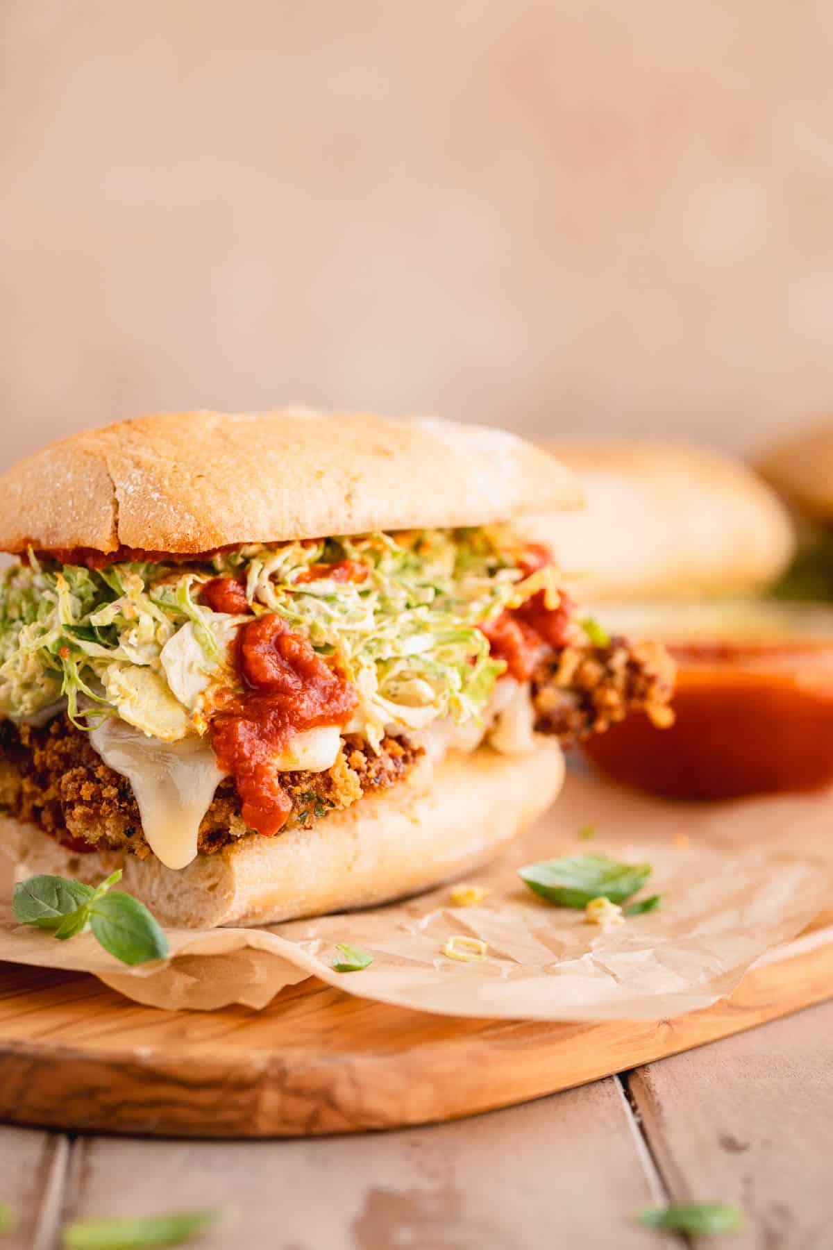 Chicken Parmesan Sandwich with Brussel Sprout Salad, and marinara on garlic bread.