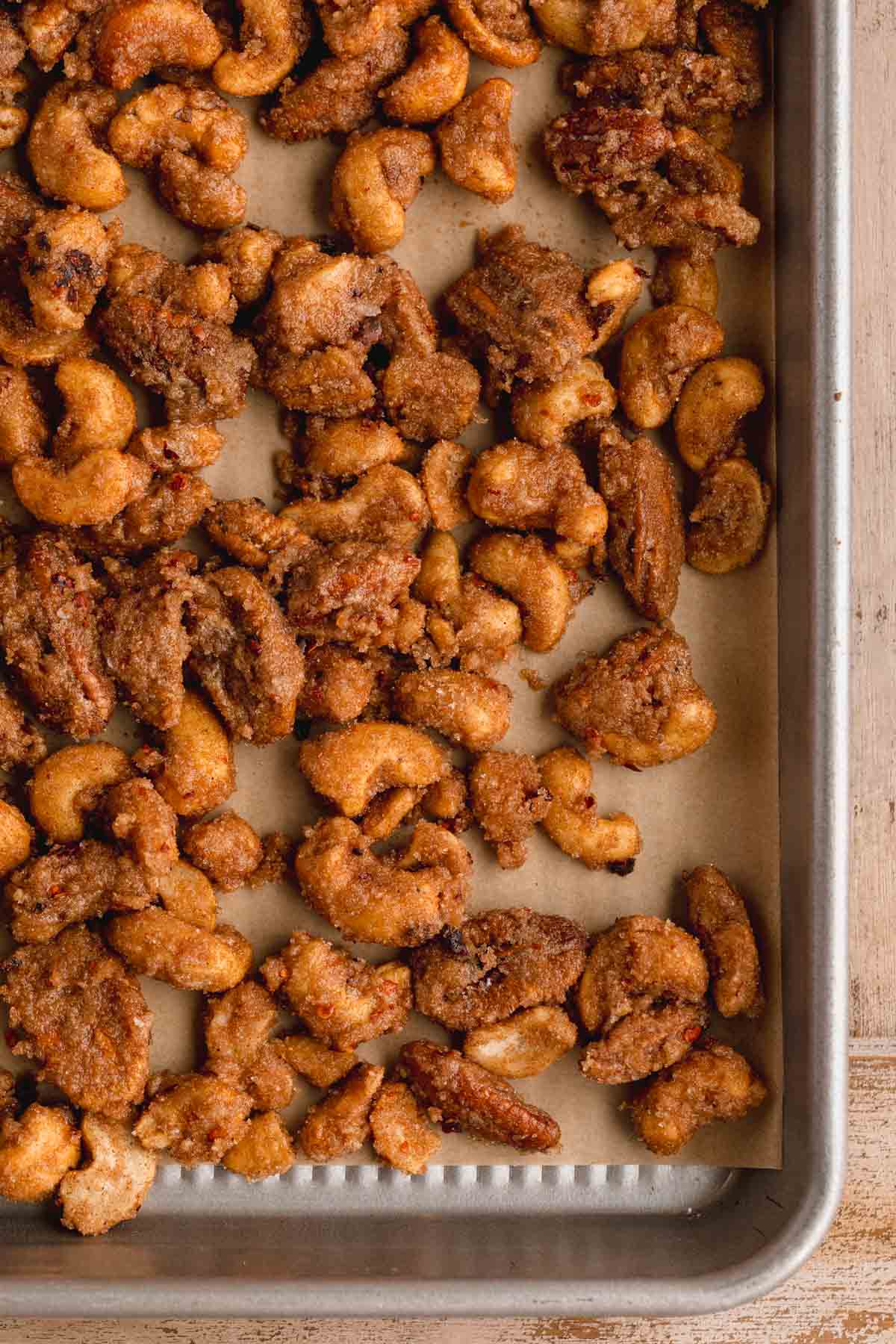 Holiday Candied Nuts on a sheet tray after being baked.