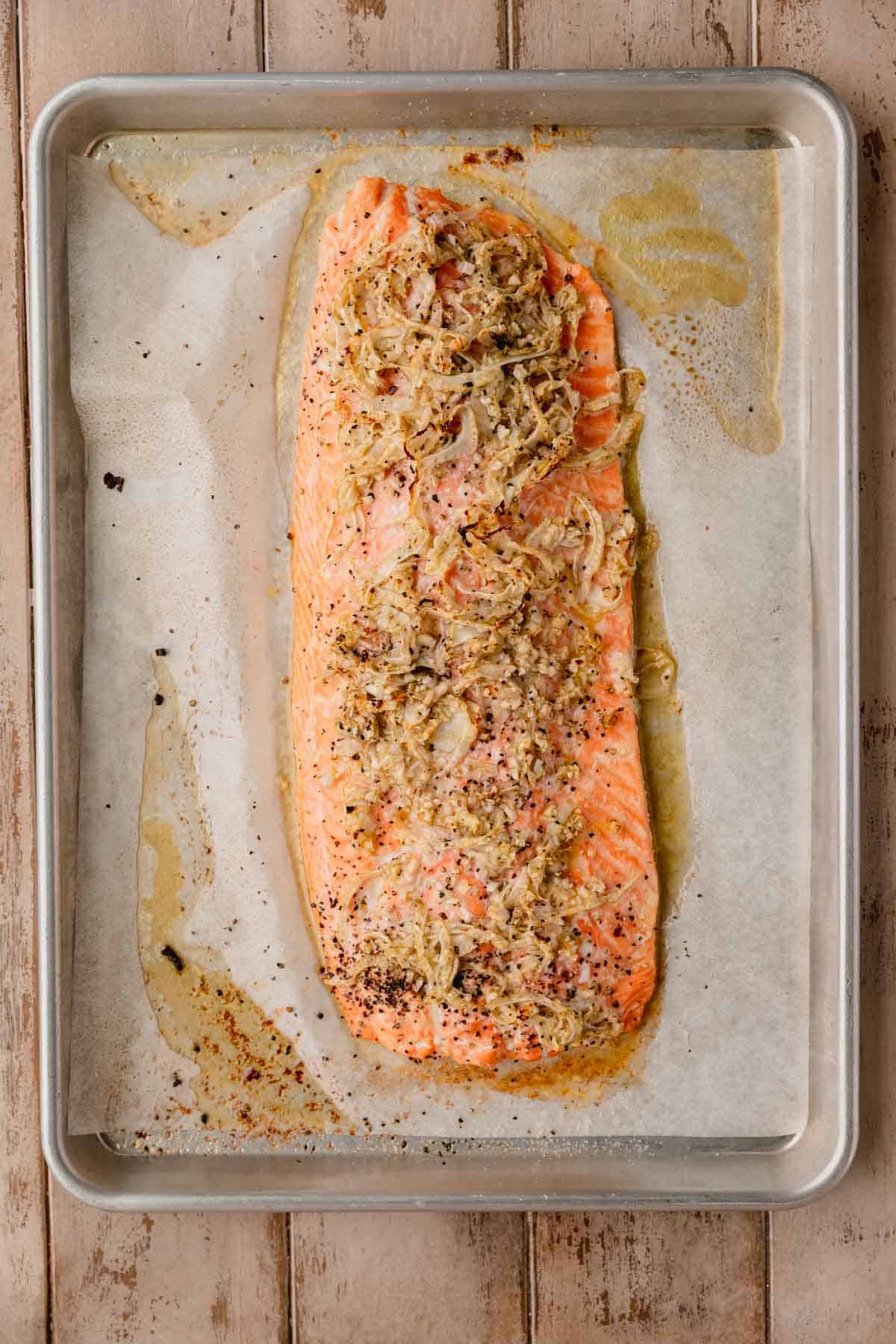 Roasted salmon with fennel and garlic mixture on top.