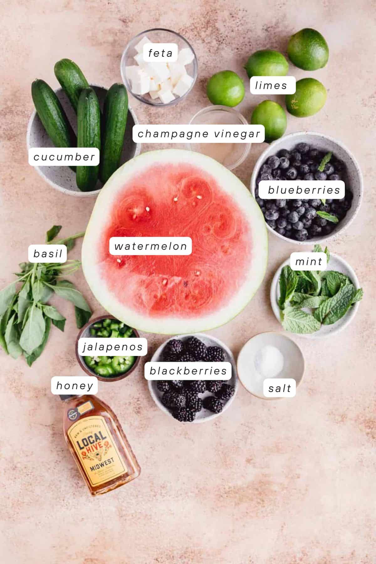 Watermelon, cucumber, feta, limes, blackberries, mint, salt, blueberries, honey, basil, champagne vinegar and jalapenos.
