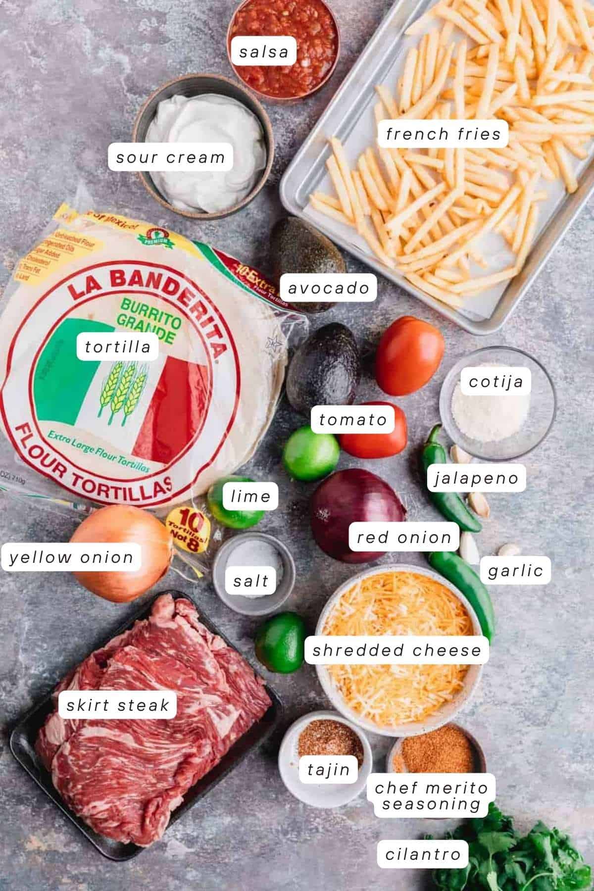 Salsa, sour cream, fries, tomato, avocado, lime, cotija, jalapeno, red and yellow onion, salt, shredded cheese, steak seasoning, Tajin, cilantro, skirt steak and tortillas.