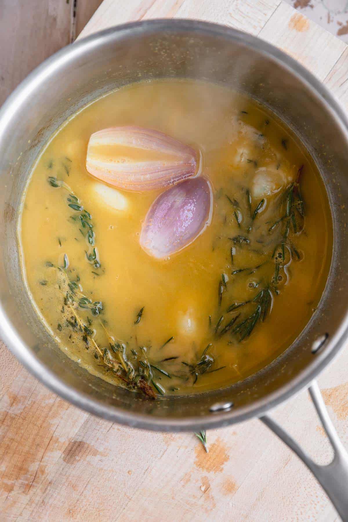 Citrus butter baste in a sauce pot.