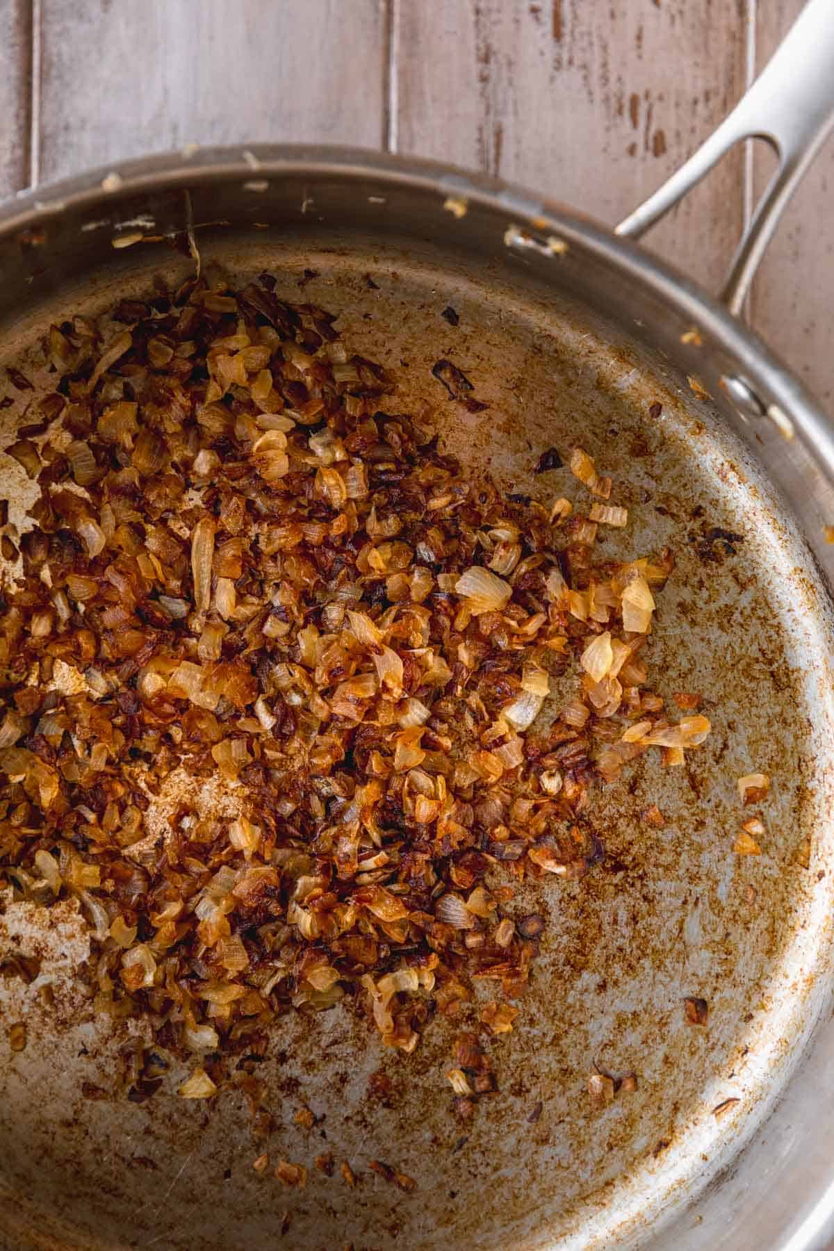 Caramelized onions in a large frying pan.
