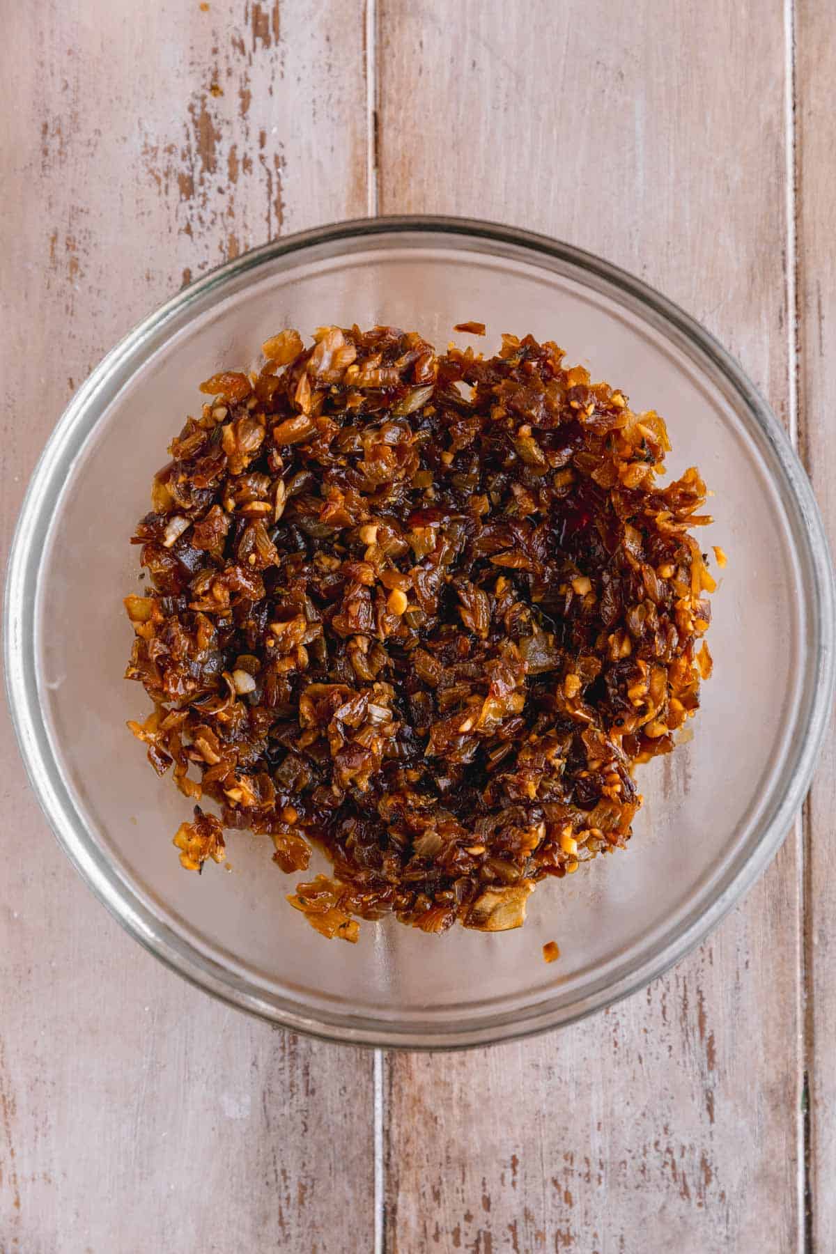 Caramelized onions in a bowl ready to chill after delgazing.