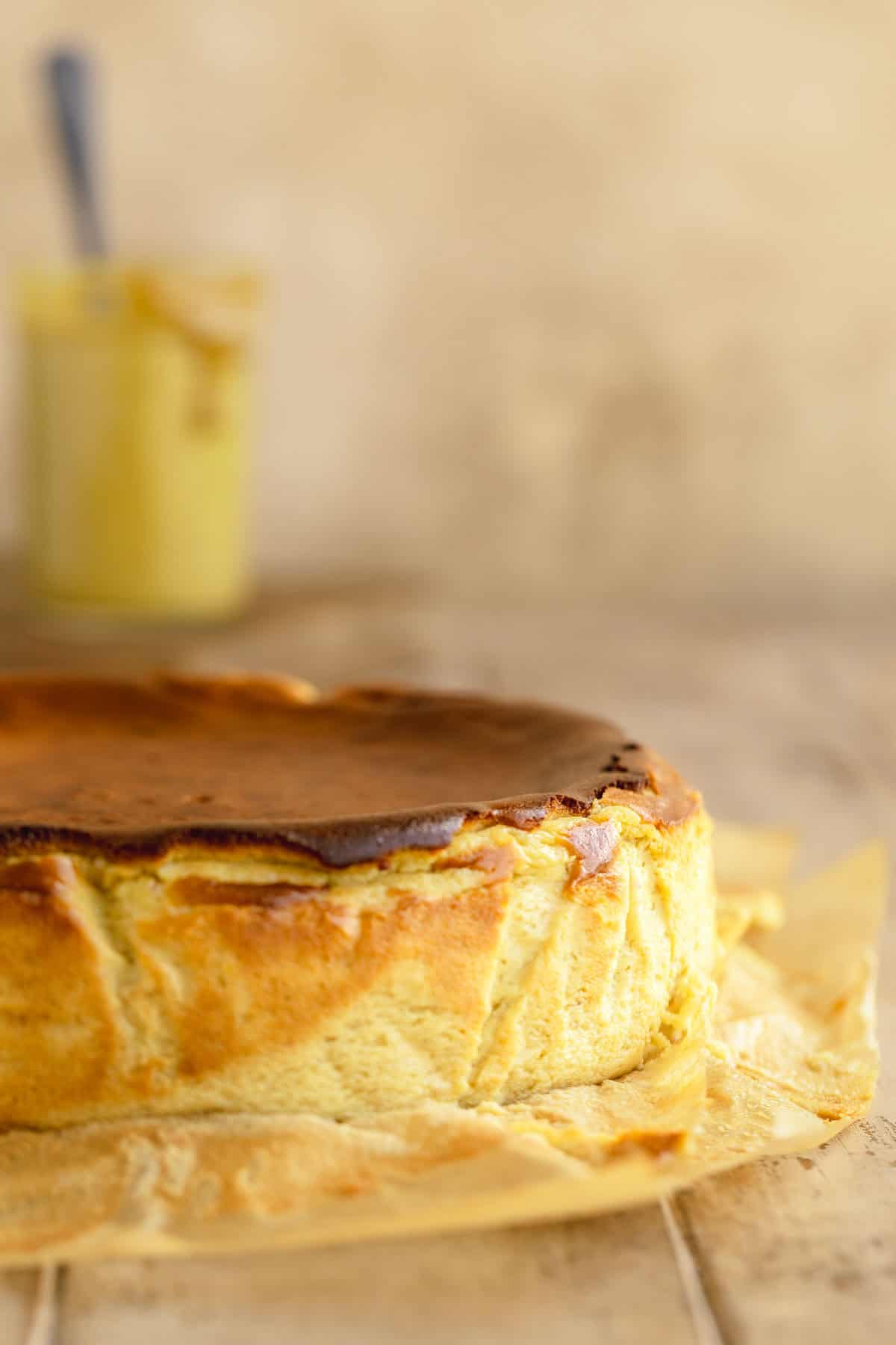 Basque Pistachio Cheesecake baked with parchment paper peeled down.