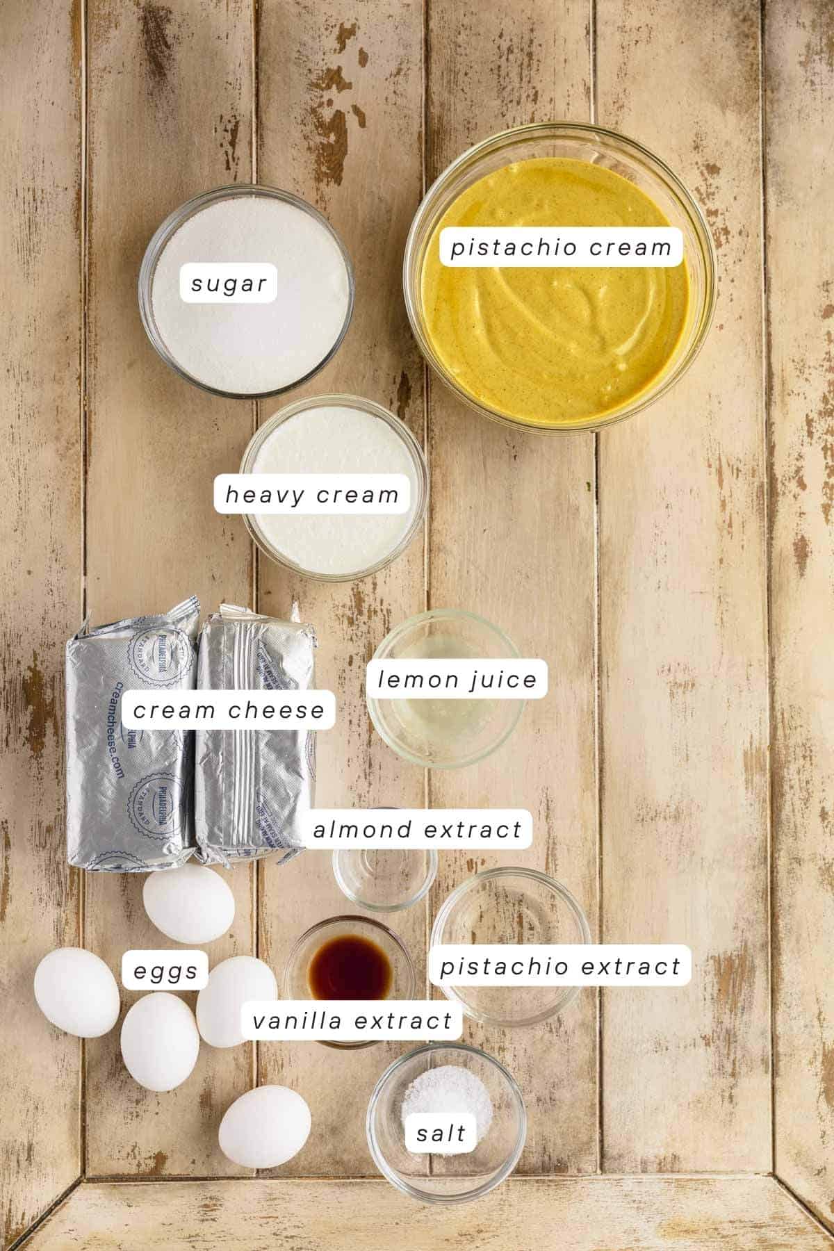 Pistachio cream, sugar, heavy cream, cream cheese, lemon juice, almond extract, pistachio extract, vanilla extract, eggs, salt and cream cheese.