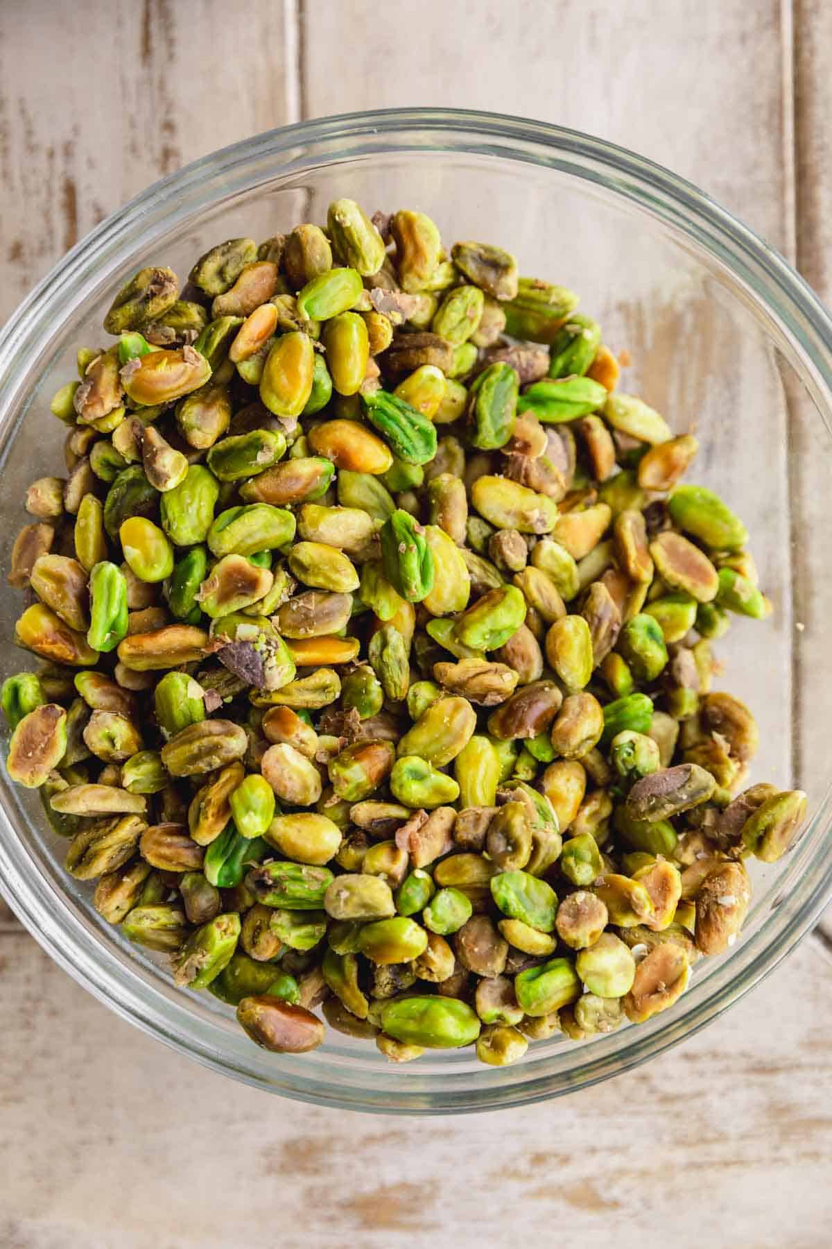 Boiled peeled pistachios in a bowl.